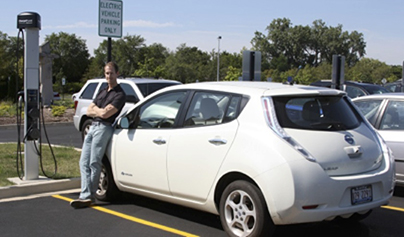 Harper Employee using Electric Vehicle Charging Station