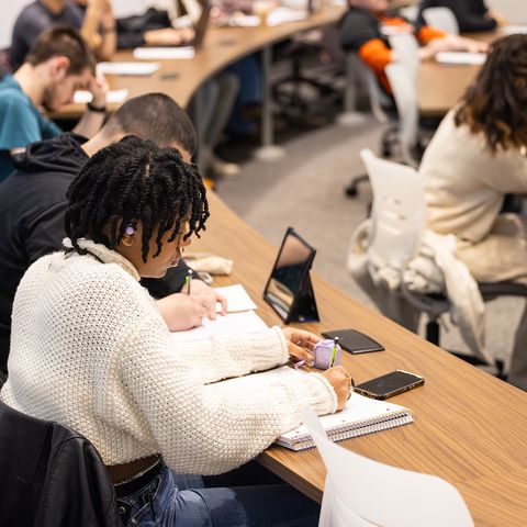 Students talking with teacher